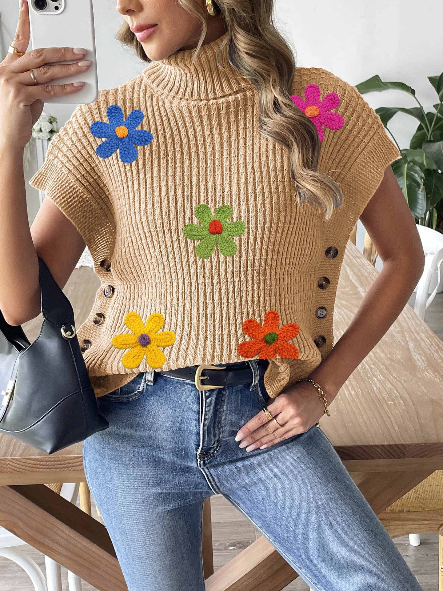 Beige knit high-neck sweater vest with colorful flower appliques and front button placket