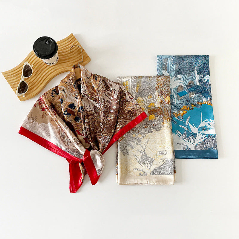 Printed satin square scarves set: blue, beige, and brown with bird-and-leaf motifs.