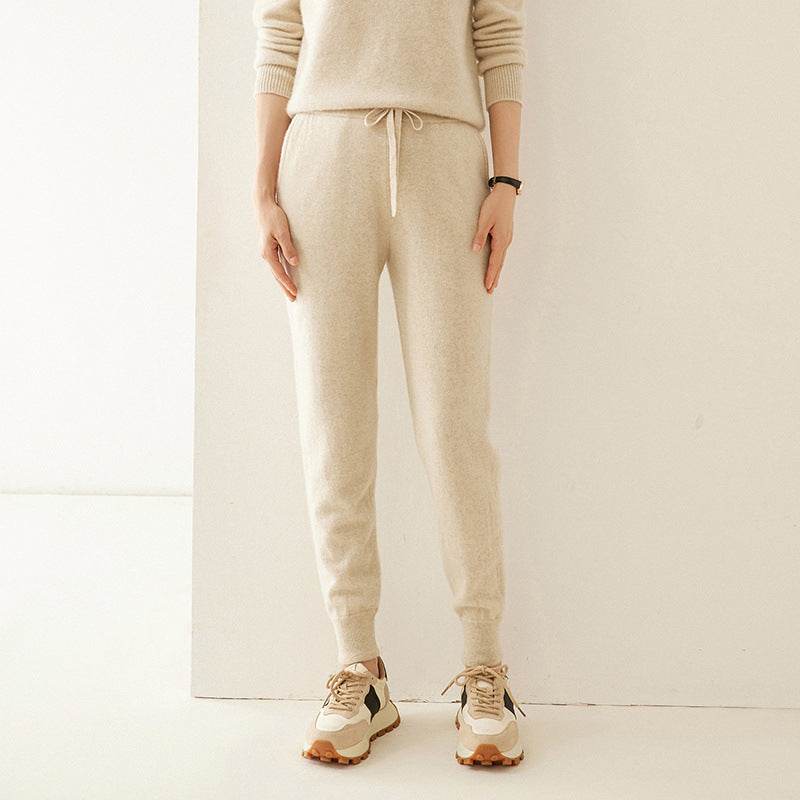 Beige cashmere-knit jogger pants with drawstring waist and tapered slim legs