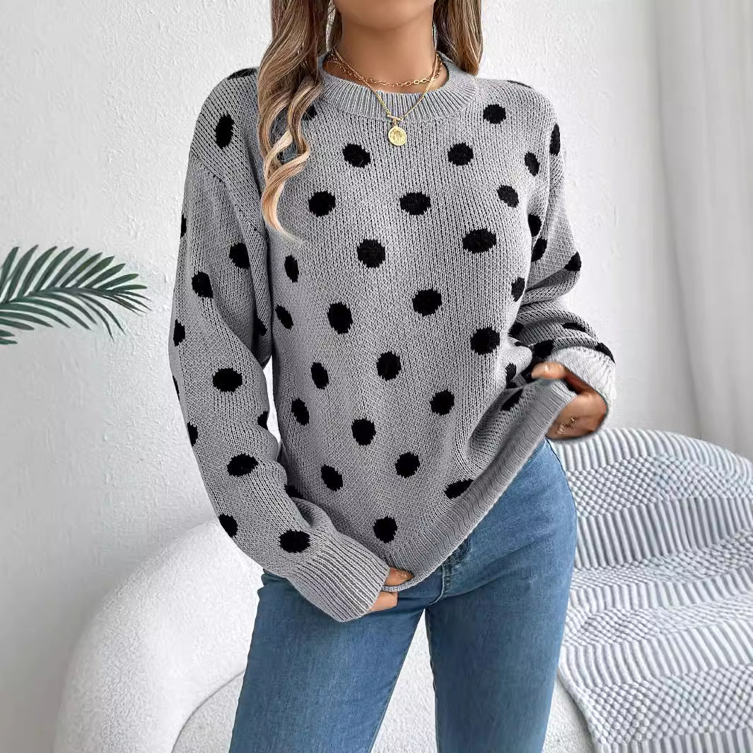 Women's polka-dot knit pullover sweater, gray with black dots and ribbed cuffs.