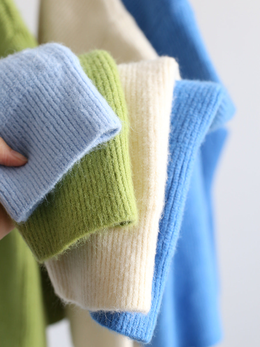 V-neck mohair cardigan cuffs and button front in light blue, green, and cream