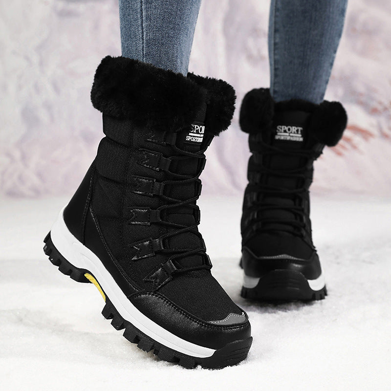 Women’s mid-calf snow boots in black with faux-fur cuff, lace-up front, thick sole