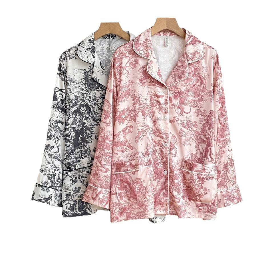Girls’ pajama set in pink and black, jungle print button-up shirts with pants