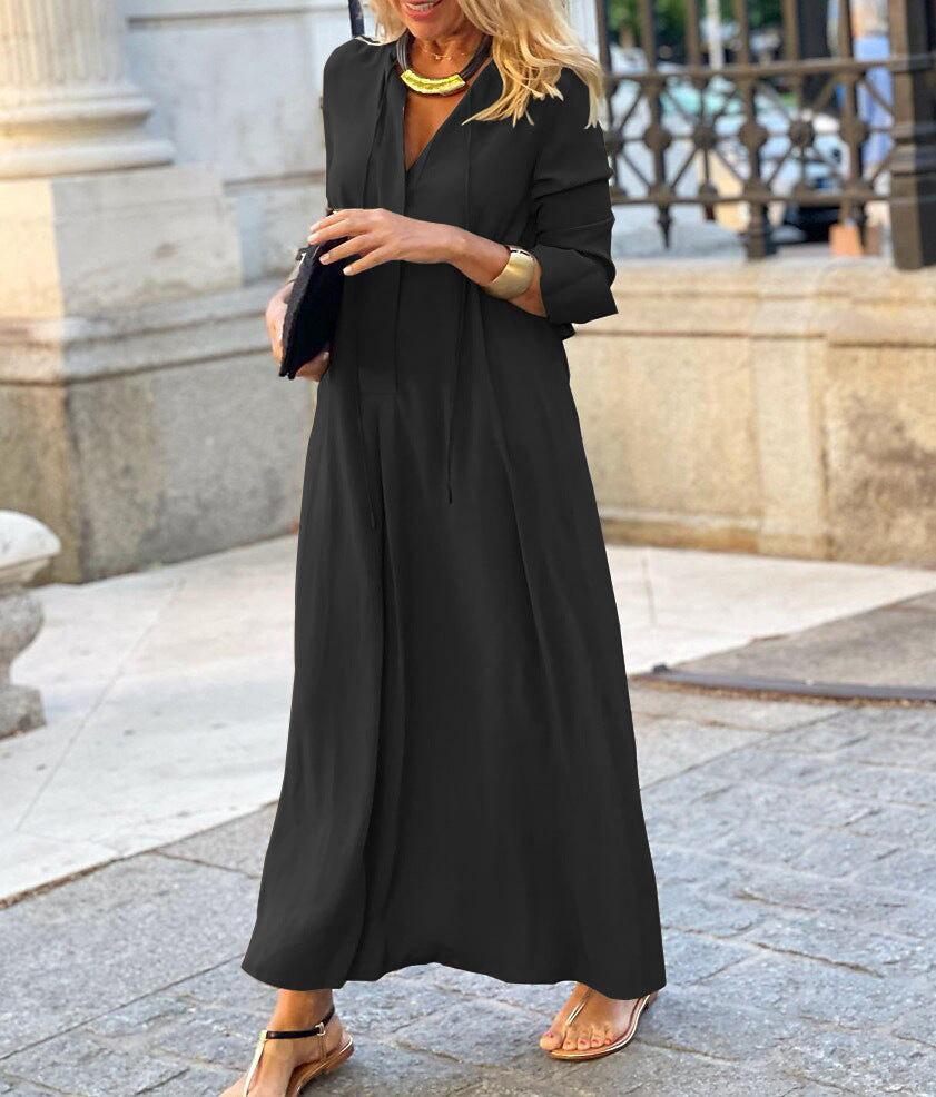 Black linen maxi dress with long sleeves, V-neck, cinched waist and flared skirt