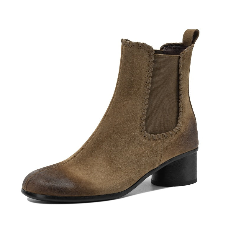 Apricot suede Chelsea ankle boot with round toe and chunky low heel, front view