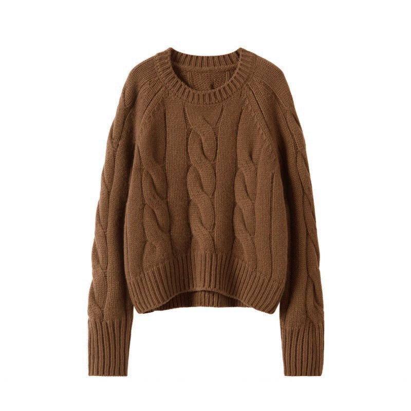 Brown chunky knit turtleneck sweater with cable texture and ribbed sleeve cuffs.