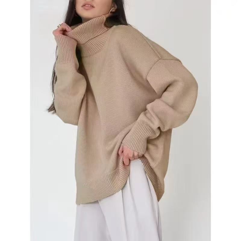 Oversized beige turtleneck sweater with ribbed collar and thick knit cuffs