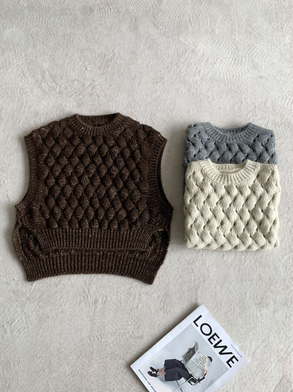 Set of cable-knit sweater vests: brown and cream, sleeveless with ribbed neck and hem