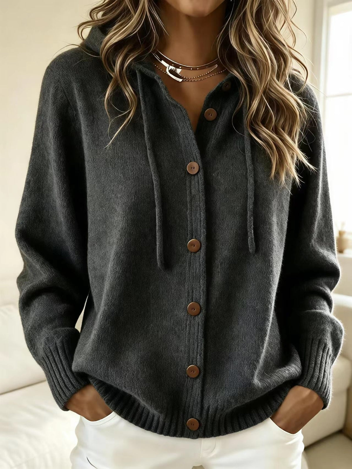 Dark gray hooded knit cardigan sweater with front button placket and drawstring hood