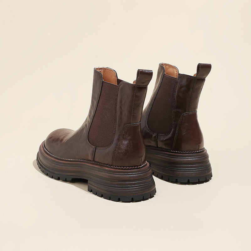 Brown leather Chelsea boots with elastic side panels and chunky platform lug sole