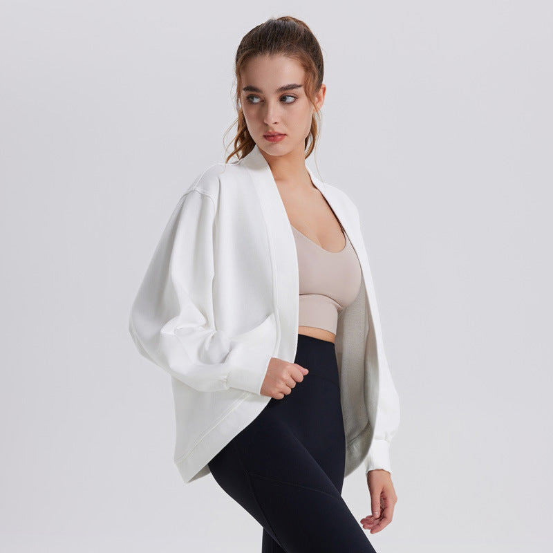 Women’s white long-sleeve athletic cardigan top, open front, loose sleeves
