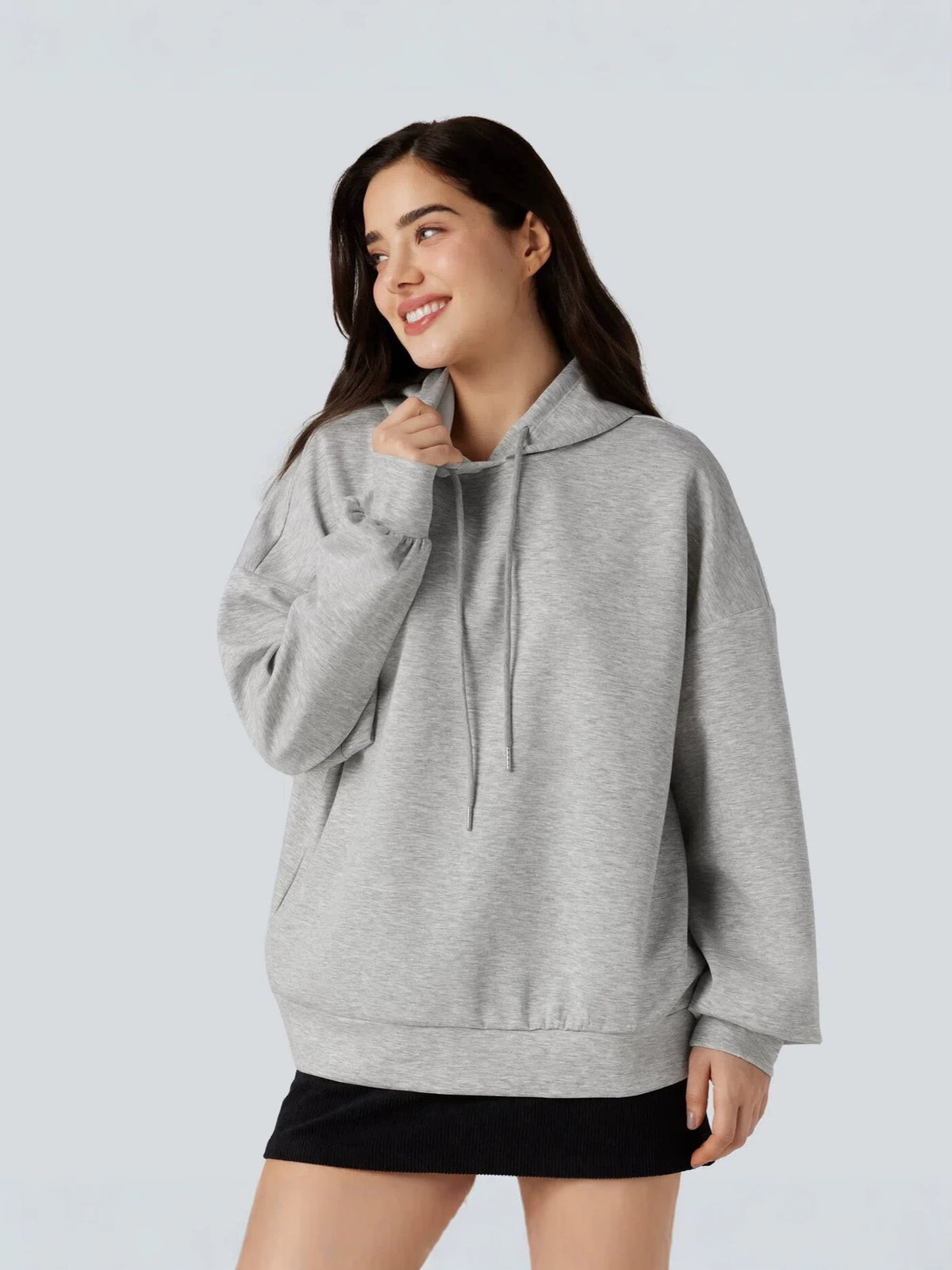 Light gray women's hoodie with drawstring hood and kangaroo pocket, relaxed fit