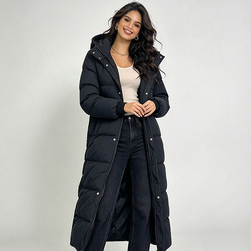 Women’s long black hooded puffer coat with button placket and quilted insulation.