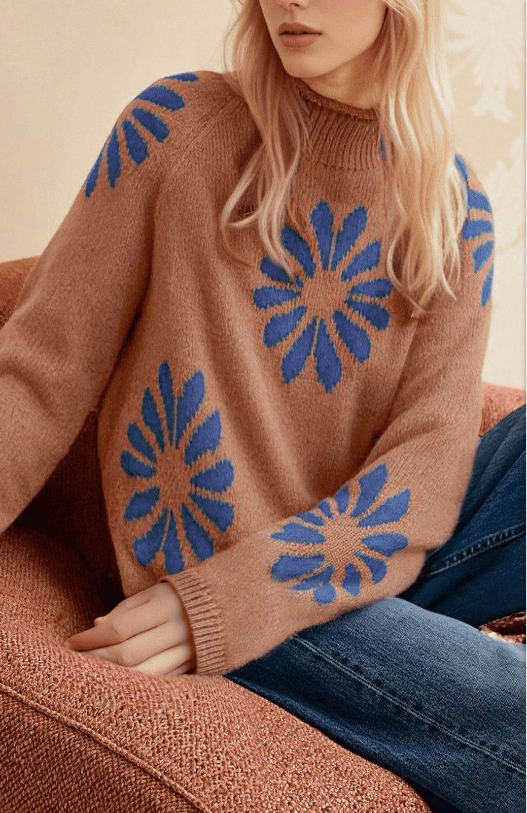 Women's brown knit sweater with blue floral motifs, ribbed round neck and cuffs