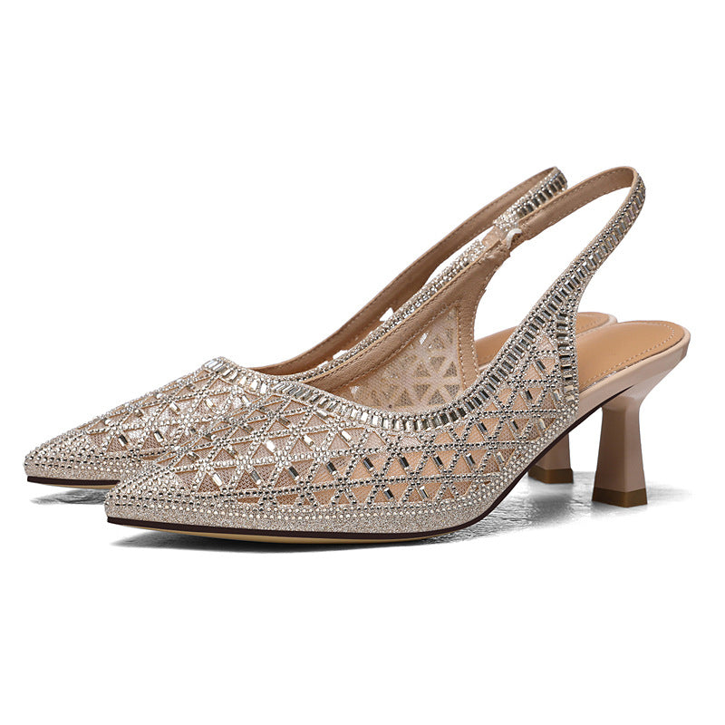 Sparkly silver pointed-toe slingback heels with geometric pattern and mid-height heel.