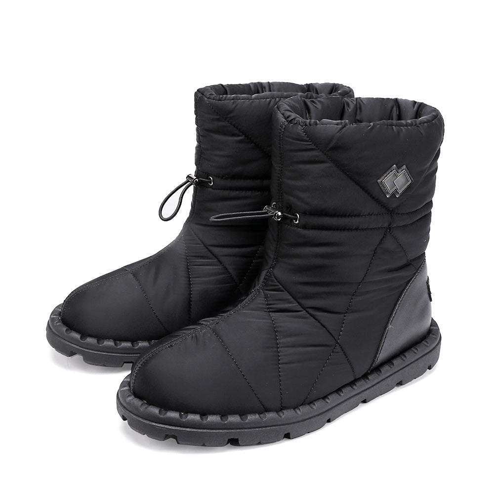 Black quilted mid-calf snow boots with lace-up ties and rubber tread sole.