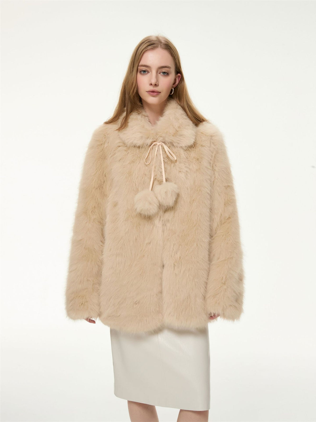 Cream faux fur coat with fur-trimmed collar, drawstring hood and pom-pom