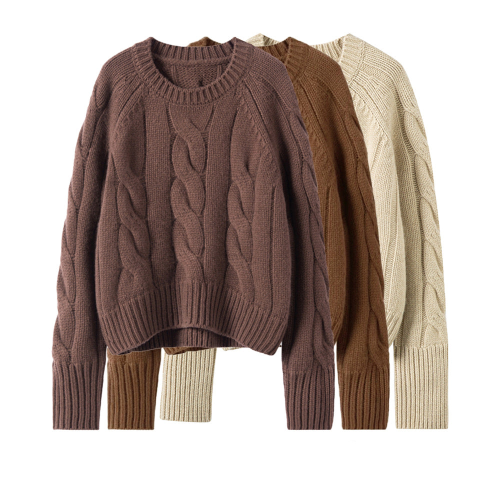 Brown cable-knit turtleneck sweater, cropped length with ribbed cuffs and hem.