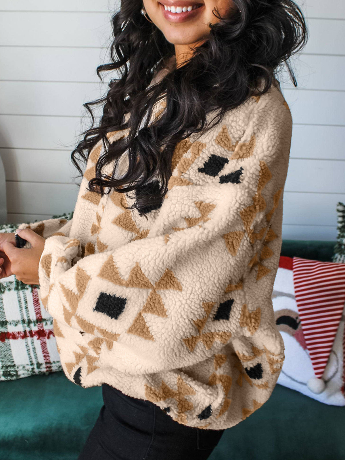 Fleece pullover sweater with beige-and-brown Aztec pattern, relaxed fit and V-neck