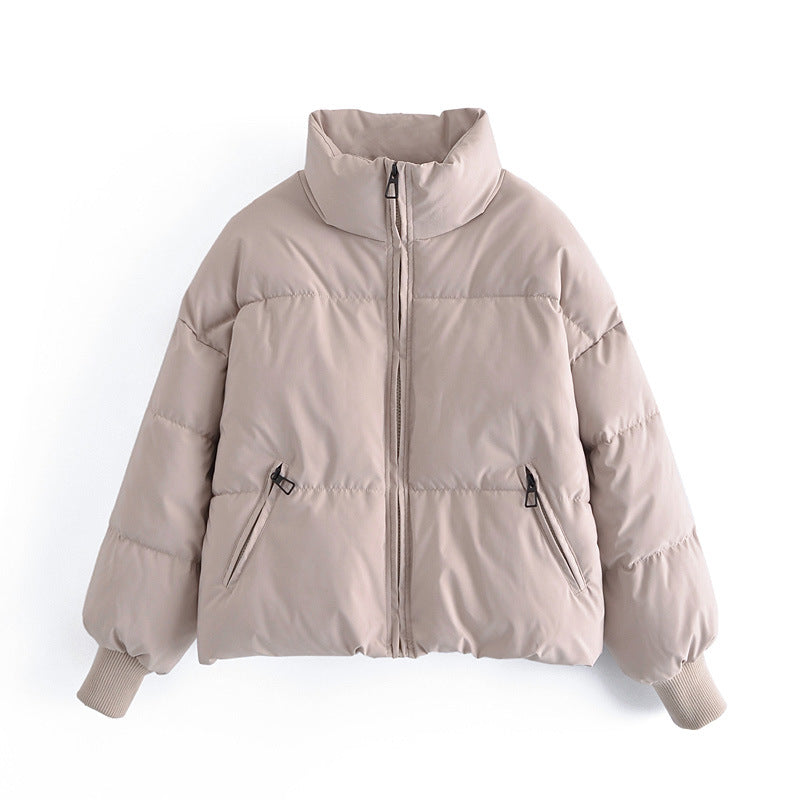 Women's light beige zip-front puffer jacket with stand collar and side pockets