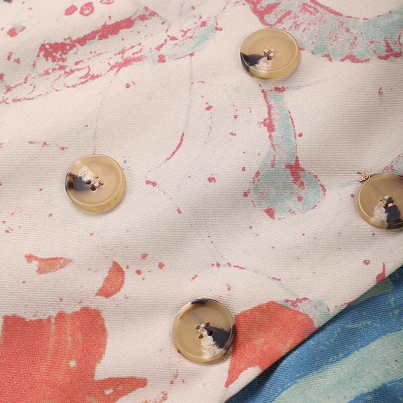 Printed fabric chest panel with four beige buttons and colorful paint pattern
