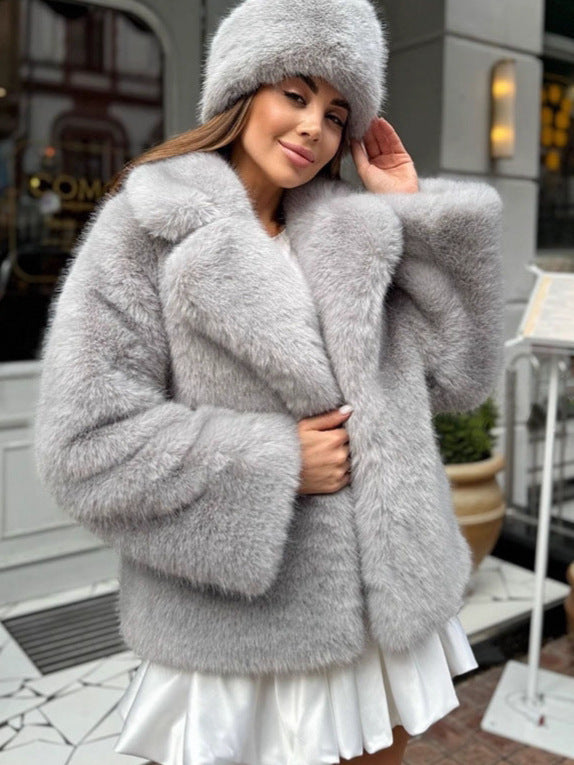 Light gray faux fur coat with hood, wide lapels, and long sleeves