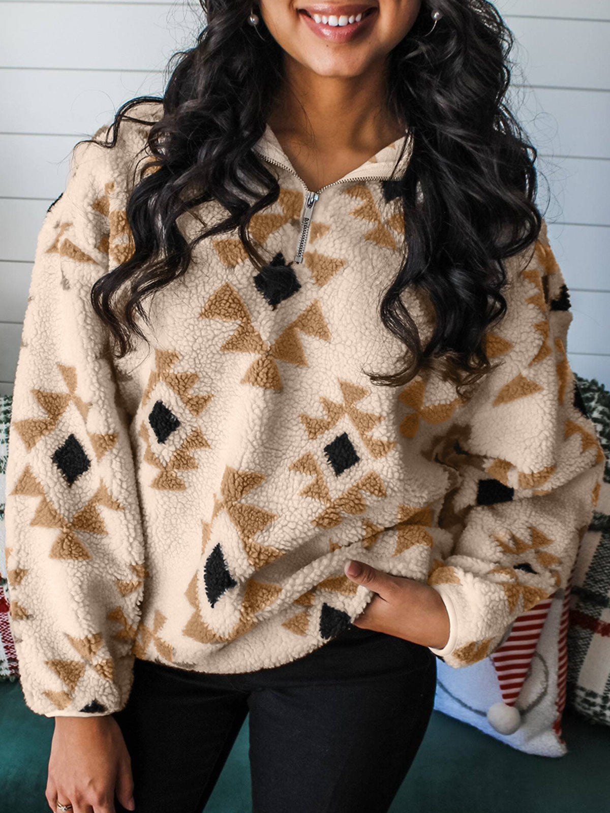 Fleece pullover sweater in beige with brown Aztec print and V-neck button placket