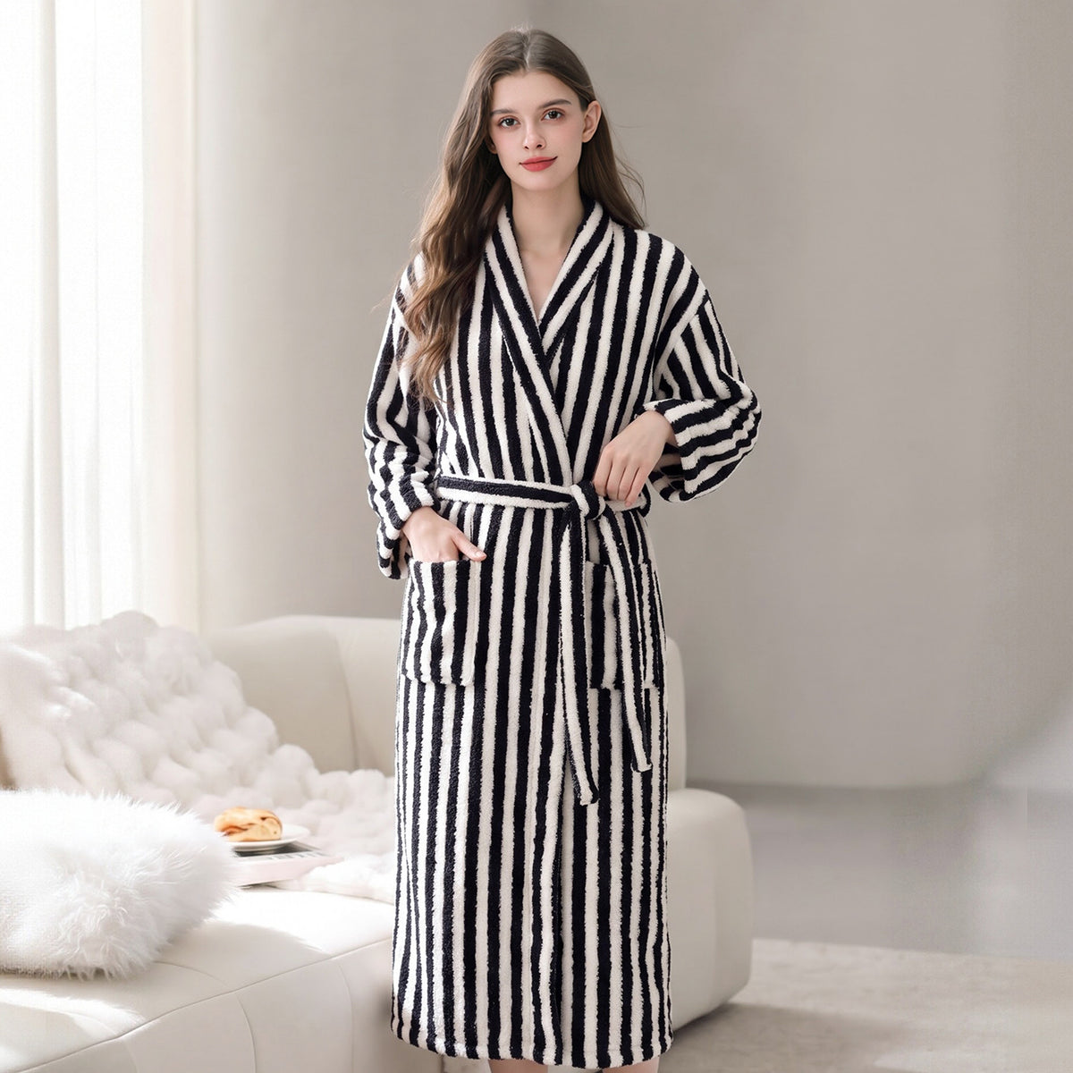Black and white striped fleece robe with shawl collar and tie belt, front pockets.