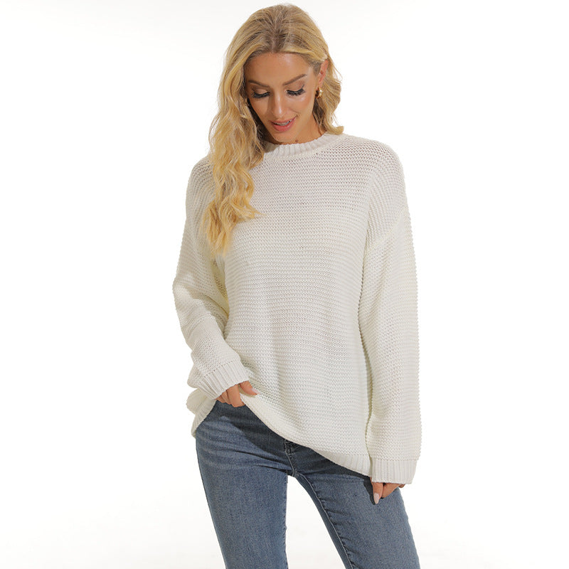 Women’s white knit pullover sweater with crew neck, long sleeves and ribbed cuffs