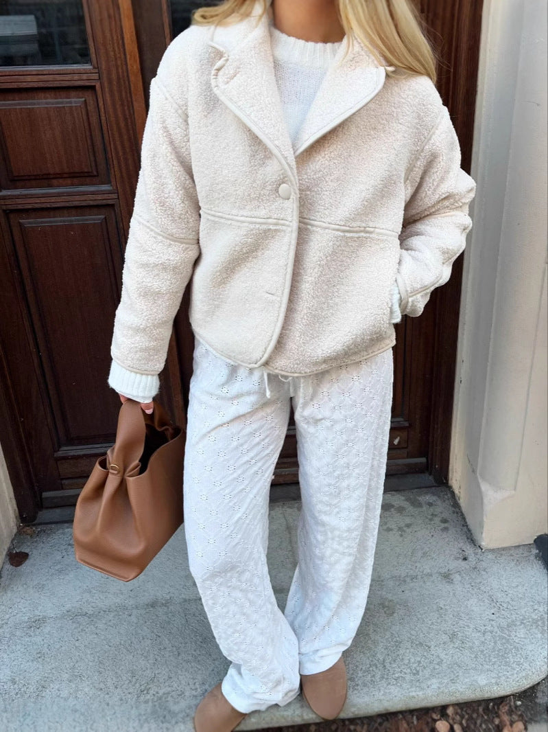 Ivory fleece cardigan jacket with notched lapels and a single-button front