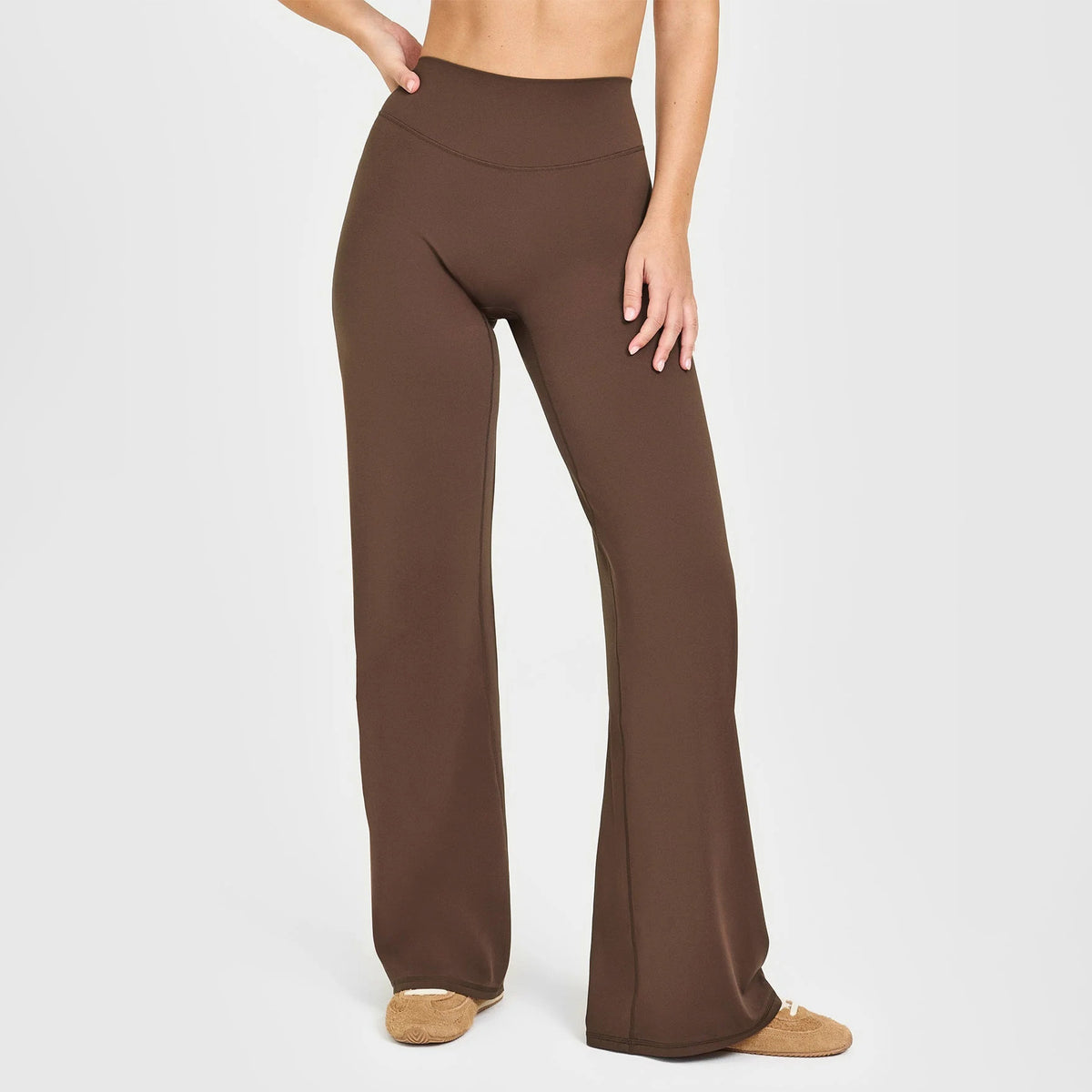 High-waisted straight-leg yoga pants in dark brown, smooth wide-leg activewear fit