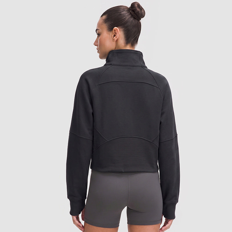 Women's half-zip sports jacket, black, high neck and relaxed back view