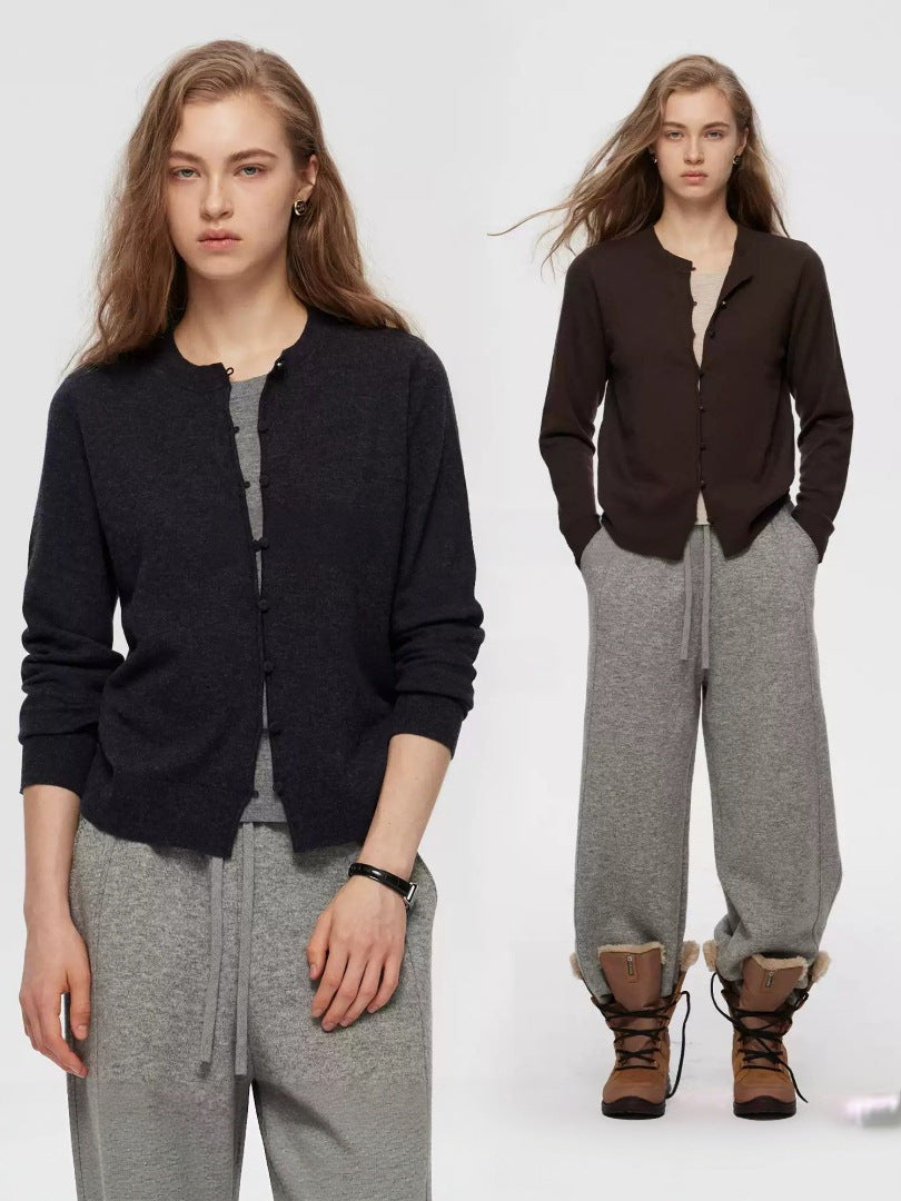 Women's black knitted cardigan with button front paired with gray drawstring pants