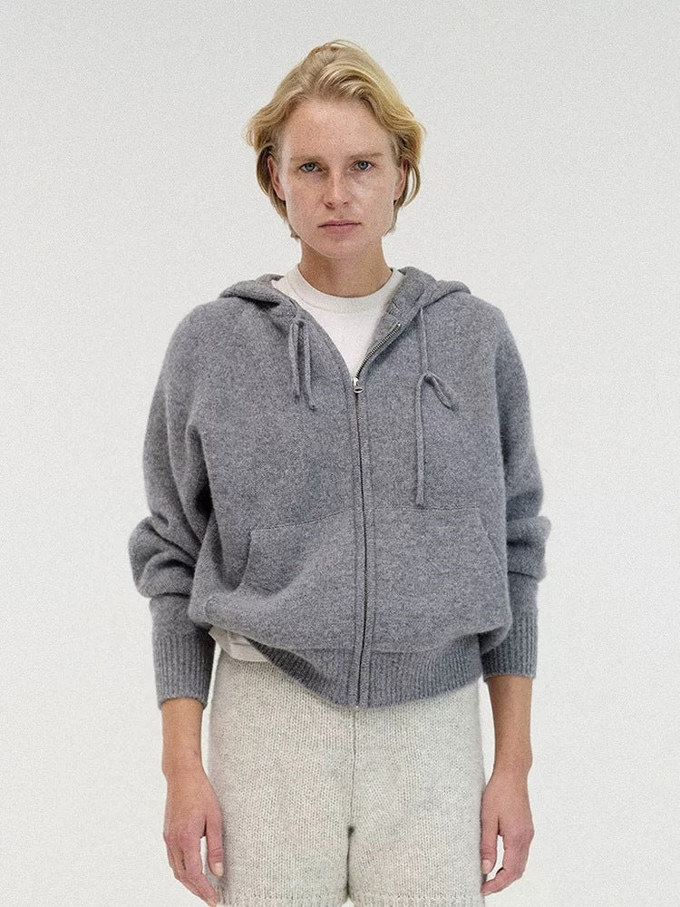 Gray hooded knit zip-up cardigan sweater with drawstring hood and ribbed hem, front view