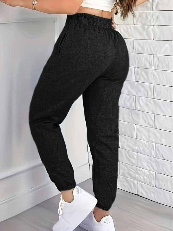 Black women's jogger pants with cuffed ankle hems and elastic waist