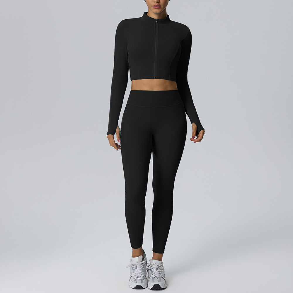 Women's black yoga set with zip long-sleeve crop top and fitted high-rise leggings
