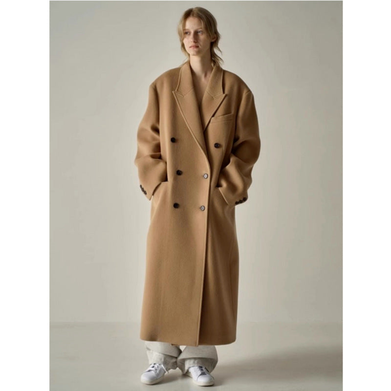 Tan long wool coat, double-breasted with wide lapels and side pockets