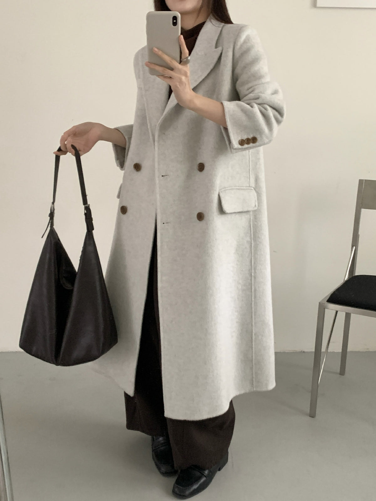 Light-gray long double-breasted cashmere coat with high collar and flap chest pocket