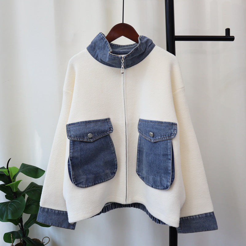 Ivory zip-front knitted cardigan with blue denim patch pockets and stand-up collar