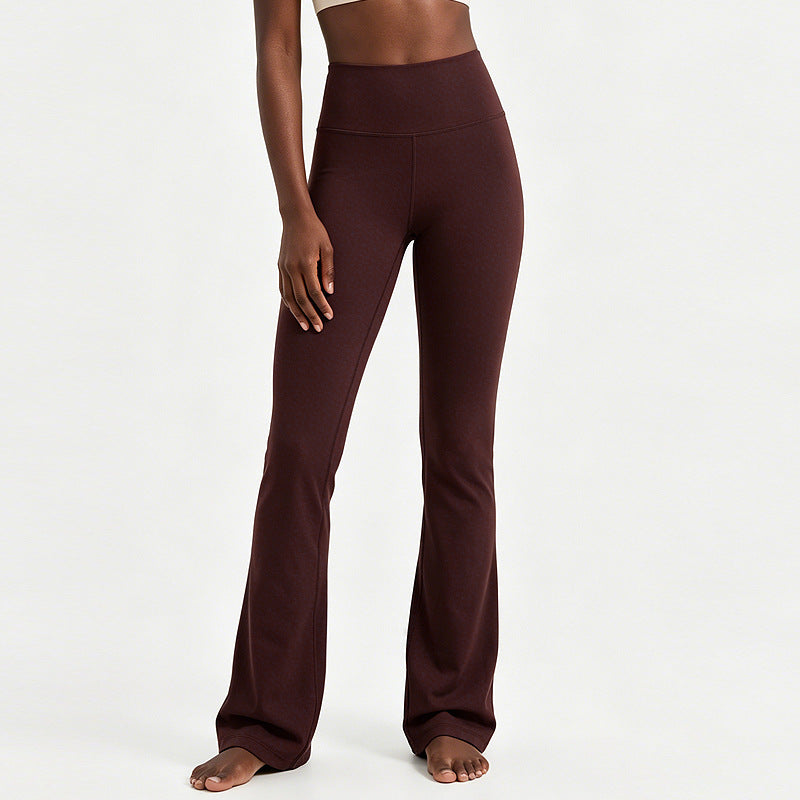 High-waisted flare yoga pants in burgundy, smooth fabric with wide bell bottom
