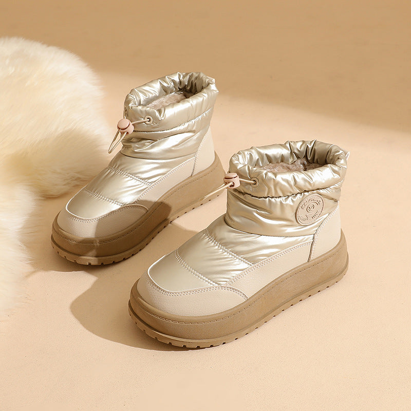 Women's khaki snow boots with padded cuff, lace-up front, and grippy rubber sole