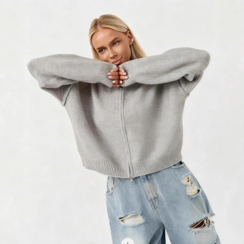 Women’s oversized zip-up cardigan sweater, light gray funnel neck, ribbed trim.