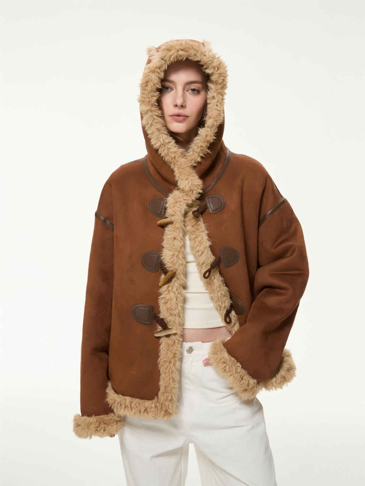 Women’s brown hooded suede shearling jacket with toggle closure and beige sherpa lining