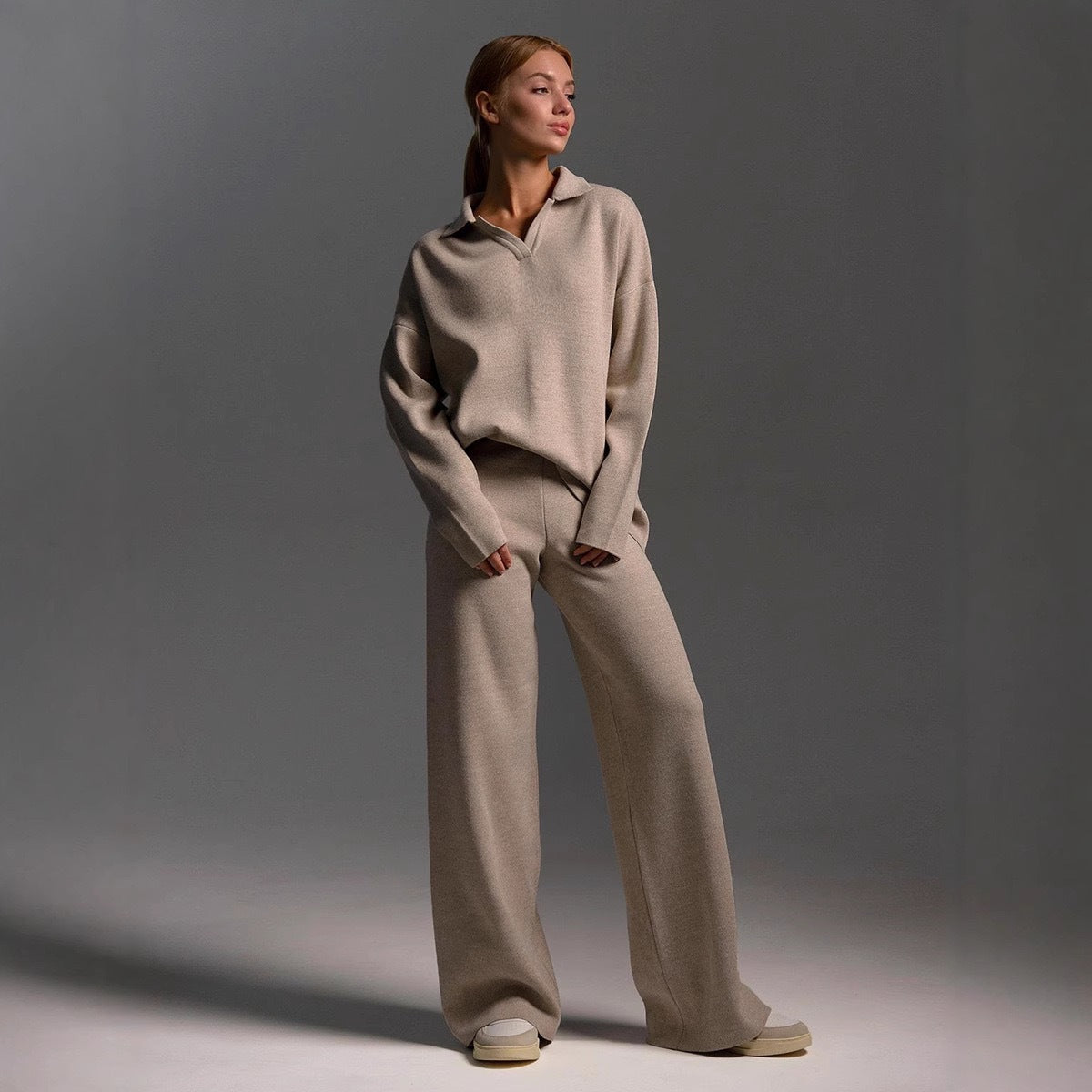 Light beige women's polo-neck two-piece set with wide-leg pants, relaxed stance