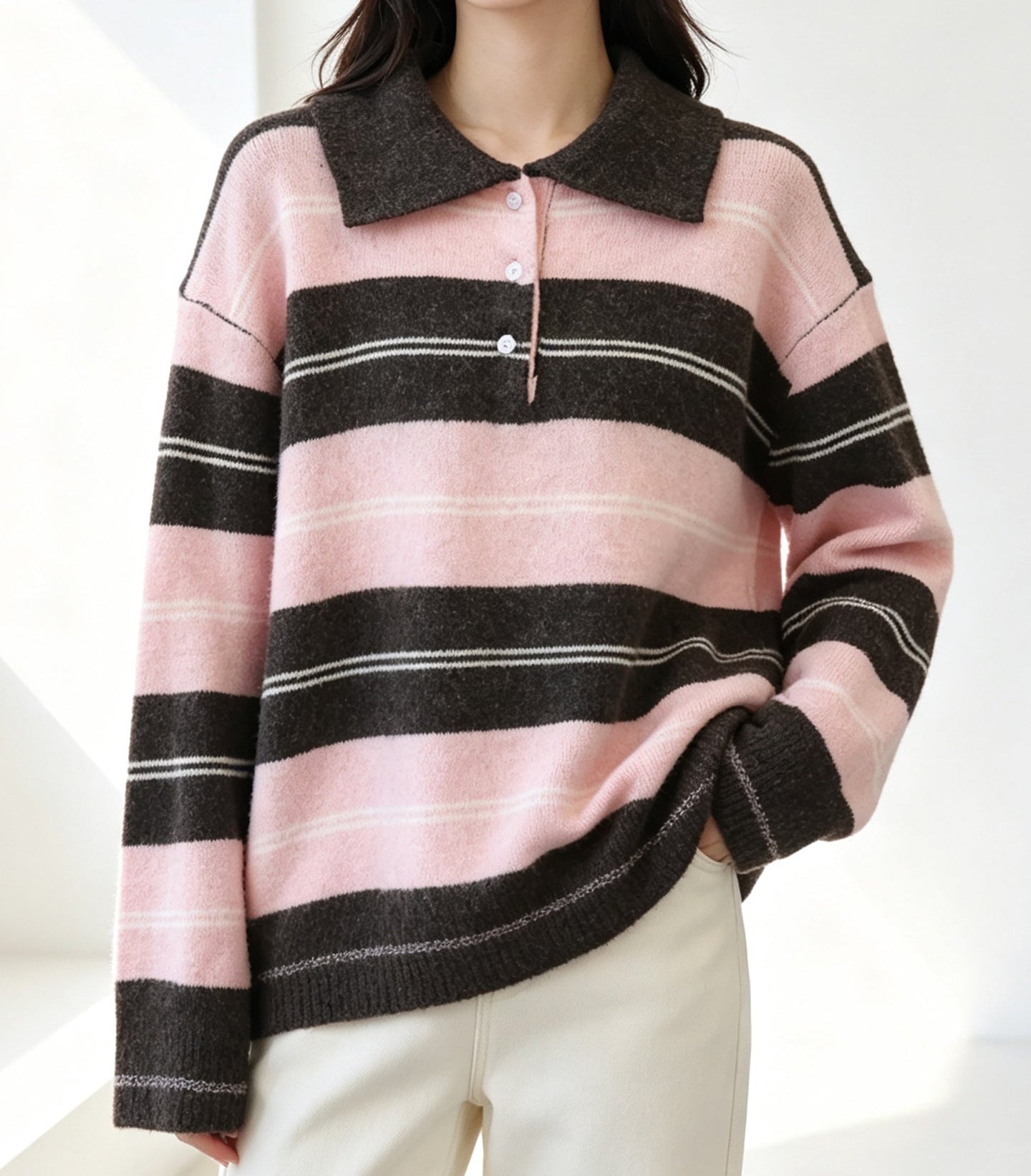 Women’s collared striped knit pullover with pink and dark gray horizontal bands.
