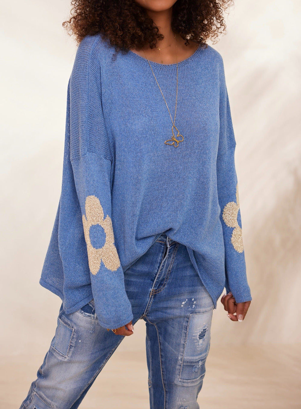 Blue floral jacquard pullover sweater, round neck, loose fit, long sleeves.