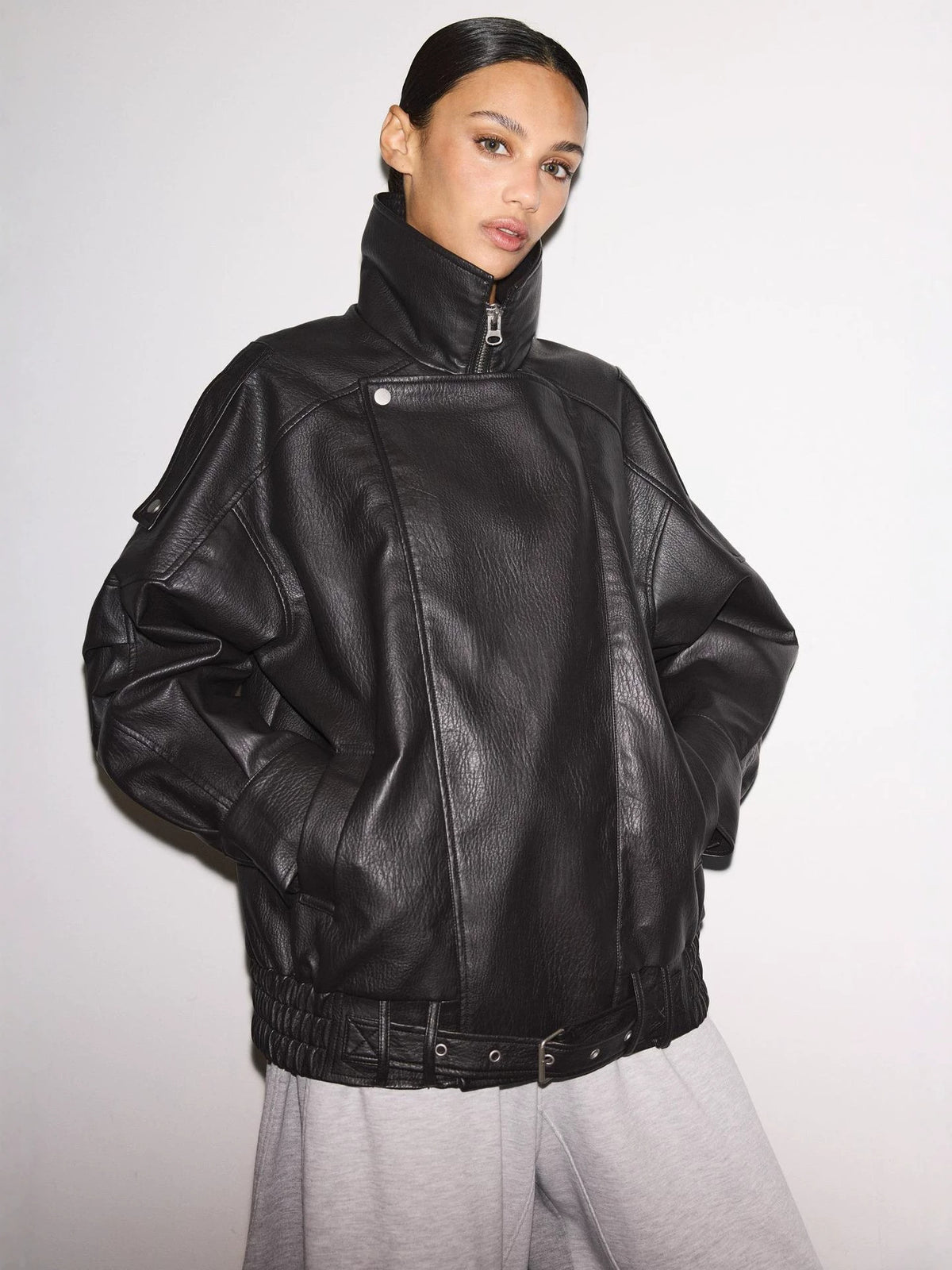 Black leather biker jacket with stand collar, front zip, quilted shoulder panel detailing