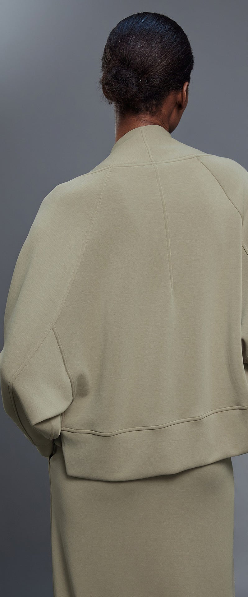 Women’s back view cropped khaki cardigan with shawl collar and side pockets