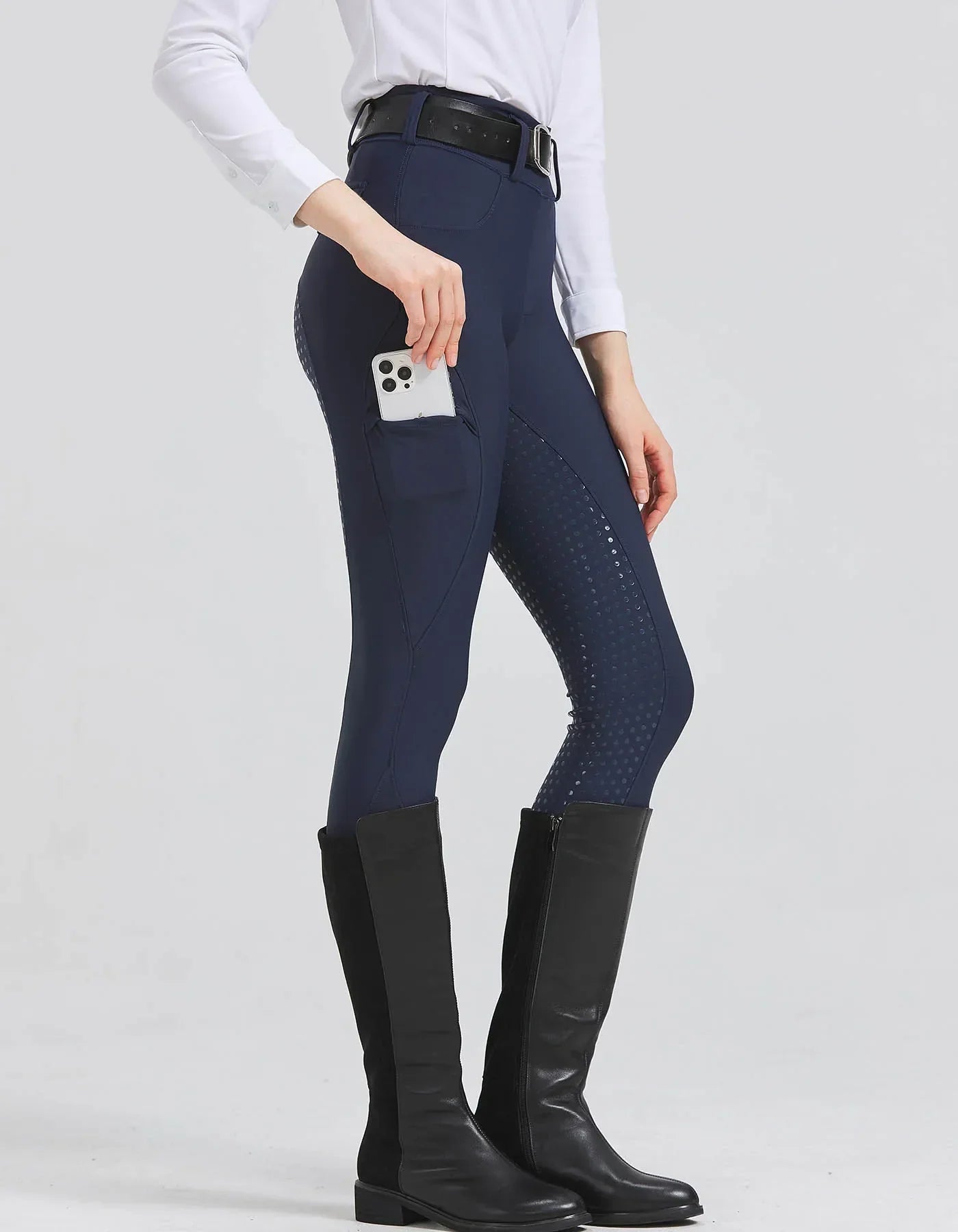 Women’s high-waist riding breeches in navy with dotted grip panels on the legs