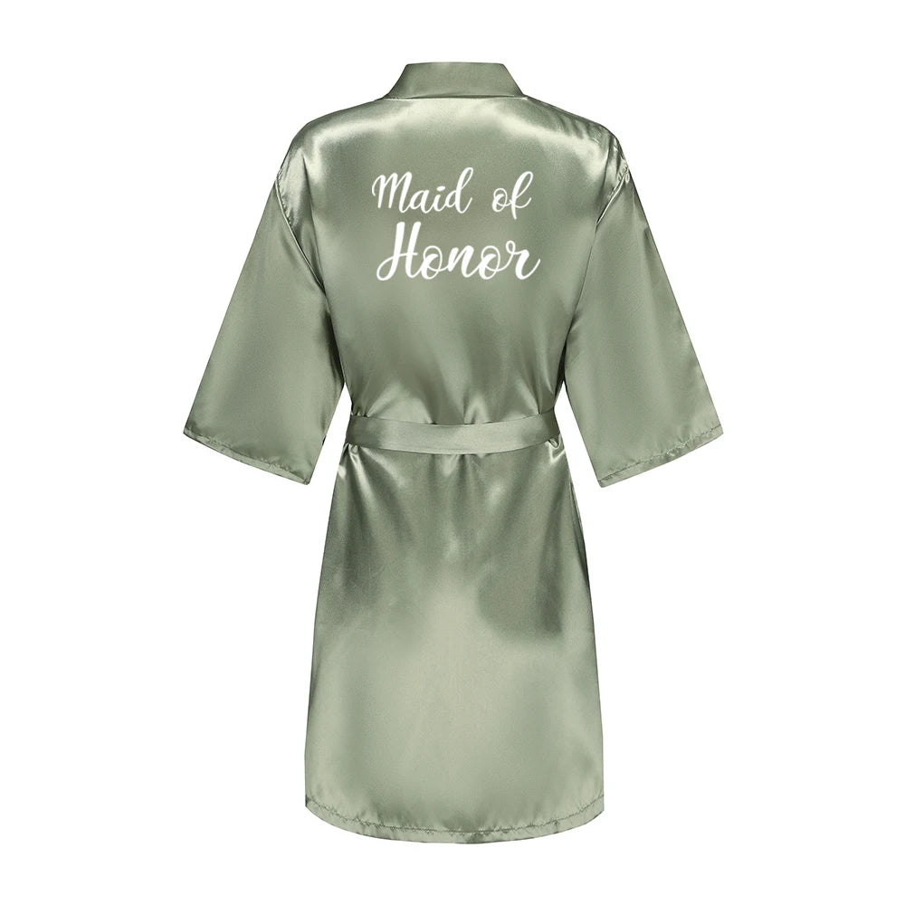 Sage green satin robe with white Maid of Honor lettering on the back
